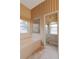 Bathroom with tub, window, and shower at 4953 Glen Coe St, Leesburg, FL 34748