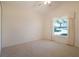 This is a comfortable carpeted bedroom with a window, closet and ceiling fan at 4953 Glen Coe St, Leesburg, FL 34748