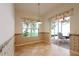 Breakfast nook with decorative wallpaper, window, and sliding door to patio at 4953 Glen Coe St, Leesburg, FL 34748
