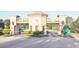 Community entrance to the property showing a gatehouse and lush landscaping at 4953 Glen Coe St, Leesburg, FL 34748