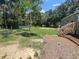 Spacious backyard with a wooden deck and shed at 4422 Cr 690, Webster, FL 33597