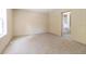 Spacious bedroom with carpet flooring and an adjacent bathroom at 4422 Cr 690, Webster, FL 33597