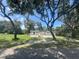 Single-wide manufactured home nestled among trees at 4422 Cr 690, Webster, FL 33597