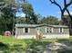 Single-wide manufactured home with a storage shed at 4422 Cr 690, Webster, FL 33597