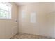 Laundry room with built-in shelving and tile floor at 4422 Cr 690, Webster, FL 33597