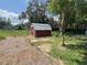 Small shed in a backyard with mulch beds at 4422 Cr 690, Webster, FL 33597