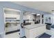 Commercial kitchen features stainless steel appliances, ample counter space, and white cabinetry at 122 Baytree Blvd, Tavares, FL 32778