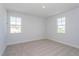 Spacious bedroom with neutral walls and carpeting at 10125 Gobat Aly, Orlando, FL 32827