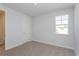 Well-lit bedroom with neutral walls and carpet at 10125 Gobat Aly, Orlando, FL 32827