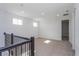 Bright and airy loft area with carpeted flooring and multiple windows at 10125 Gobat Aly, Orlando, FL 32827