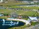 This aerial showcases the neighborhood's vibrant recreational area, complete with lake, sports fields and activities for everyone at 10218 Dulbecco St, Orlando, FL 32827