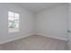 Bright bedroom with carpeted floor and window at 10260 Medawar St, Orlando, FL 32827