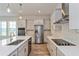 Modern kitchen with stainless steel appliances and white cabinetry at 10260 Medawar St, Orlando, FL 32827