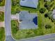 Beautiful home featuring solar panels, lush landscaping, and a manicured yard at 1751 Ashwood Run, The Villages, FL 32162