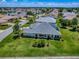 A lush green lawn and landscaped yard provides privacy for this lovely home at 1751 Ashwood Run, The Villages, FL 32162