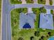 This gorgeous aerial view showcases solar panels on the house and mature landscaping at 1751 Ashwood Run, The Villages, FL 32162