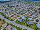 Picture of golf community highlighting a single-Gathering home with a well-manicured lawn at 1751 Ashwood Run, The Villages, FL 32162