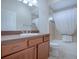 Clean bathroom features a spacious vanity, large mirror, and shower-tub combination with tile surround at 1751 Ashwood Run, The Villages, FL 32162