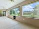 Spacious screened patio, offering views of the lush backyard and ample natural light at 1751 Ashwood Run, The Villages, FL 32162