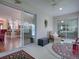 Enclosed lanai featuring an indoor/outdoor connection with glass sliders providing views into the home at 1751 Ashwood Run, The Villages, FL 32162