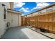 Private backyard with wooden fence and concrete patio at 6299 River Run Pl # 198, Orlando, FL 32807