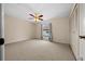 Spacious bedroom with ceiling fan and ample closet space at 6299 River Run Pl # 198, Orlando, FL 32807