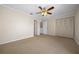 Spacious bedroom with ceiling fan and double closets at 6299 River Run Pl # 198, Orlando, FL 32807