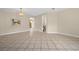 Open dining area with tile floors and access to kitchen at 6299 River Run Pl # 198, Orlando, FL 32807