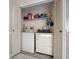 Laundry room with washer, dryer, and shelving at 6299 River Run Pl # 198, Orlando, FL 32807