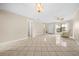 Open living room with tile floor, and lots of natural light at 6299 River Run Pl # 198, Orlando, FL 32807