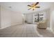 Living area featuring tile floors and a ceiling fan at 6299 River Run Pl # 198, Orlando, FL 32807
