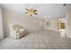 Bright living room with tile floors and ceiling fan at 6299 River Run Pl # 198, Orlando, FL 32807