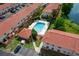 Community pool with surrounding lounge chairs at 6299 River Run Pl # 198, Orlando, FL 32807