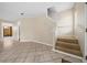 Beige carpeted staircase leading to the second floor at 6299 River Run Pl # 198, Orlando, FL 32807