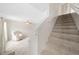 Beige carpeted staircase with tile flooring at 6299 River Run Pl # 198, Orlando, FL 32807