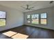 Spacious bedroom with large windows and wood flooring at 16122 Pendio Dr, Bella Collina, FL 34756