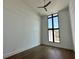 Bright bedroom with large window and hardwood floors at 16122 Pendio Dr, Bella Collina, FL 34756