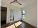 Bedroom with wood floors, ceiling fan, and en-suite bathroom at 16122 Pendio Dr, Bella Collina, FL 34756
