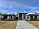 Luxury home showcasing modern design and landscaping at 16122 Pendio Dr, Bella Collina, FL 34756