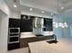 Contemporary kitchen featuring a gas cooktop and ample counter space at 16122 Pendio Dr, Bella Collina, FL 34756