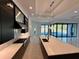 Modern kitchen with stainless steel appliances and marble countertops at 16122 Pendio Dr, Bella Collina, FL 34756