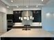 Modern kitchen with stainless steel appliances and large island at 16122 Pendio Dr, Bella Collina, FL 34756