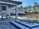 Luxury outdoor kitchen with stainless steel grill and sink at 16122 Pendio Dr, Bella Collina, FL 34756