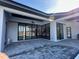 Spacious patio with access to the pool and backyard at 16122 Pendio Dr, Bella Collina, FL 34756