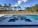 Large pool and spa with a beautiful backyard view at 16122 Pendio Dr, Bella Collina, FL 34756