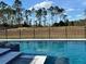 Inviting pool and spa with a tranquil view at 16122 Pendio Dr, Bella Collina, FL 34756