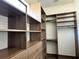 Large walk-in closet with ample shelving and drawers at 16122 Pendio Dr, Bella Collina, FL 34756