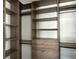 Large walk-in closet featuring shelves, drawers, and hanging rods at 16122 Pendio Dr, Bella Collina, FL 34756