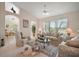 Bright living room with vaulted ceilings, plush seating and a decorative ceiling fan at 8043 Pine Hollow Dr, Mount Dora, FL 32757