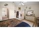 Bedroom with a view of the ensuite bathroom and walk-in closet, offering spaciousness and convenience at 8043 Pine Hollow Dr, Mount Dora, FL 32757